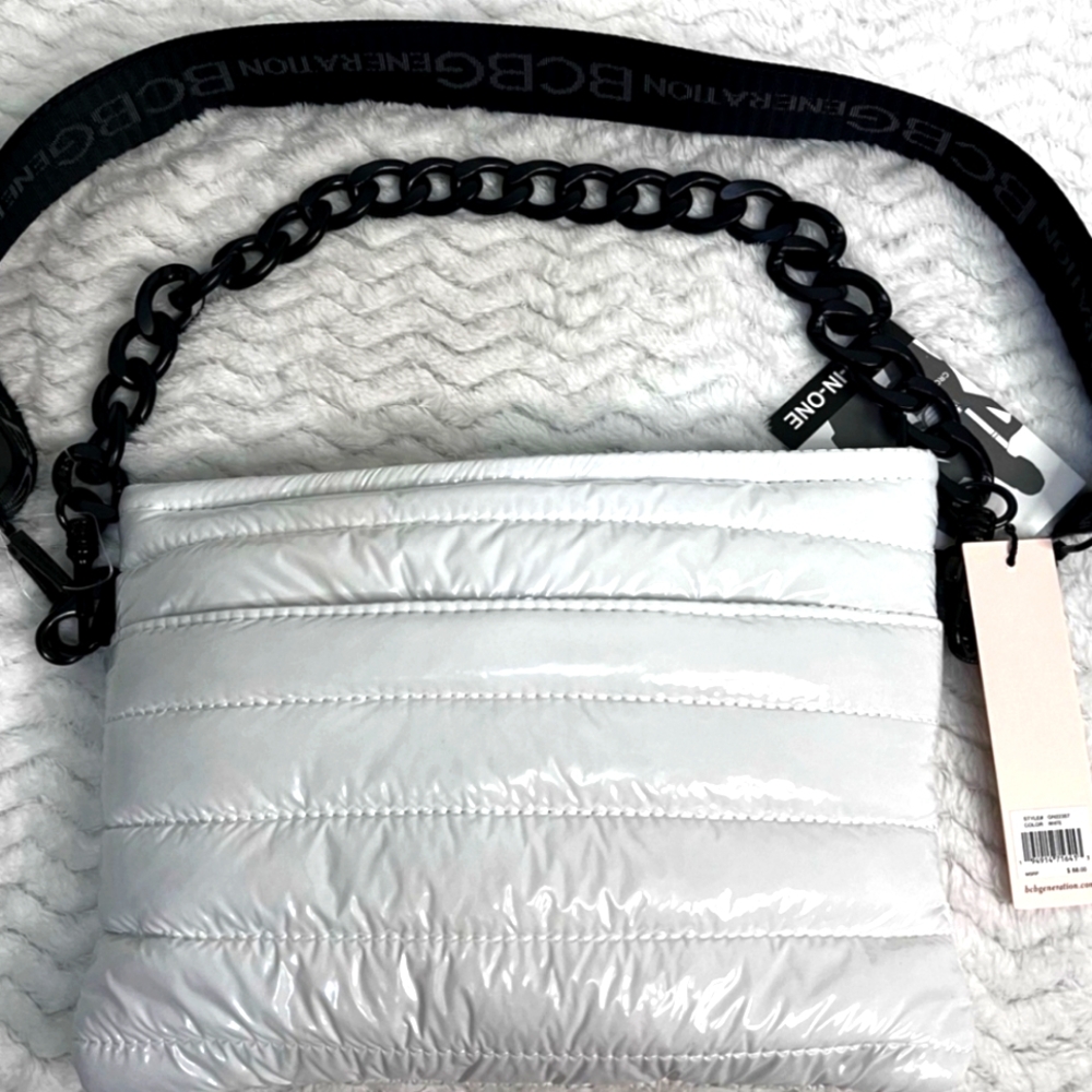 BCBGeneration crossbody & shoulder bag white with black strap, chain & zippers.
